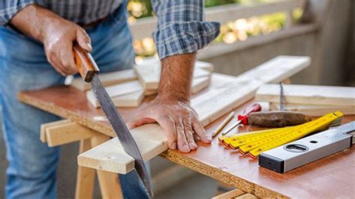 What does a carpenter do when building a house?