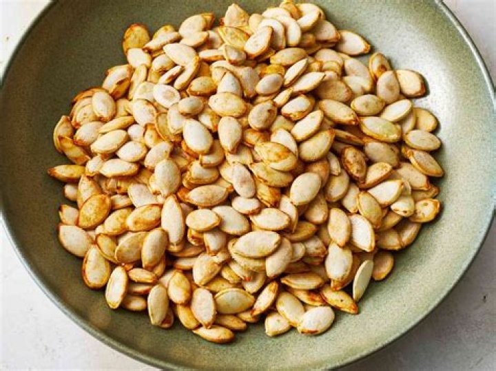 What is a serving of shelled pumpkin seeds?